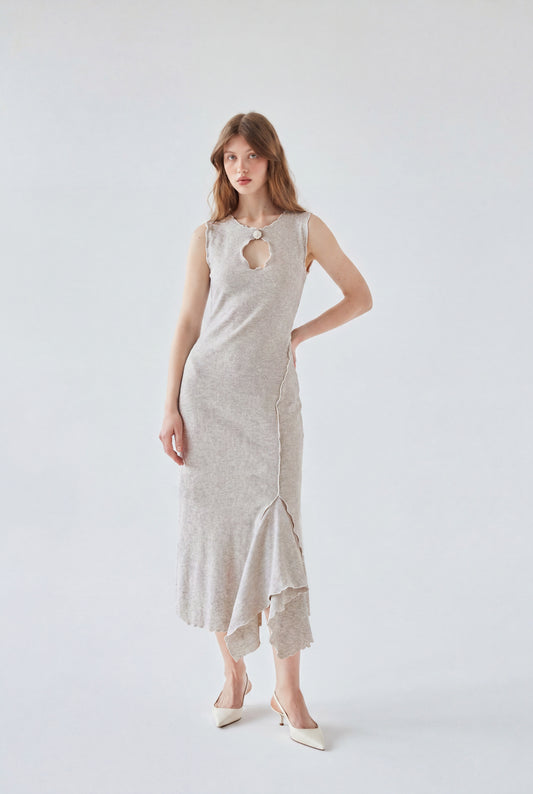 Model wearing a light grey sleeveless midi dress with an asymmetrical front cut-out, raw-edge seams, and a soft draped hem.